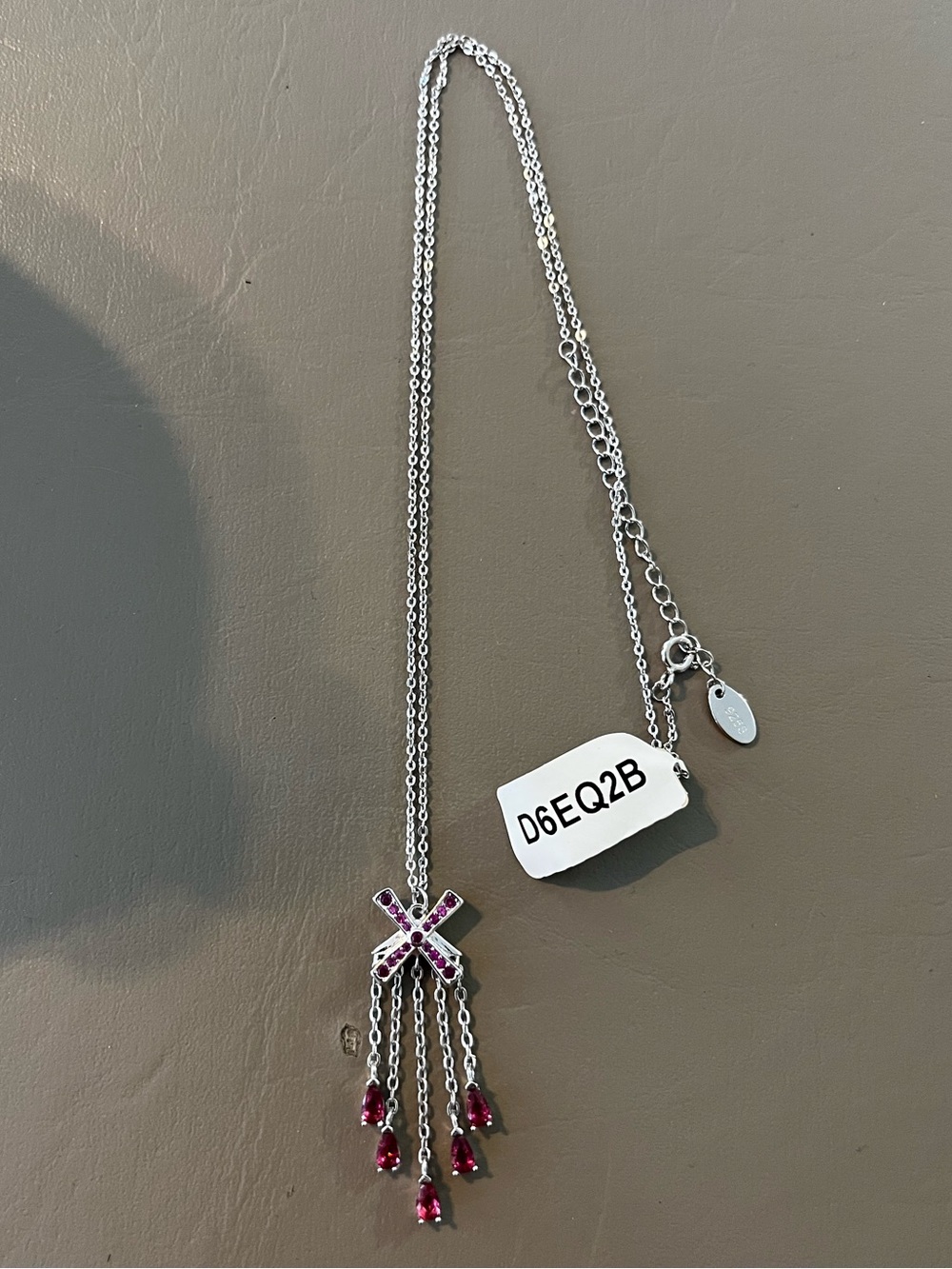 Charmed Aroma | Silver X Necklace With Pink Dangling Stones
